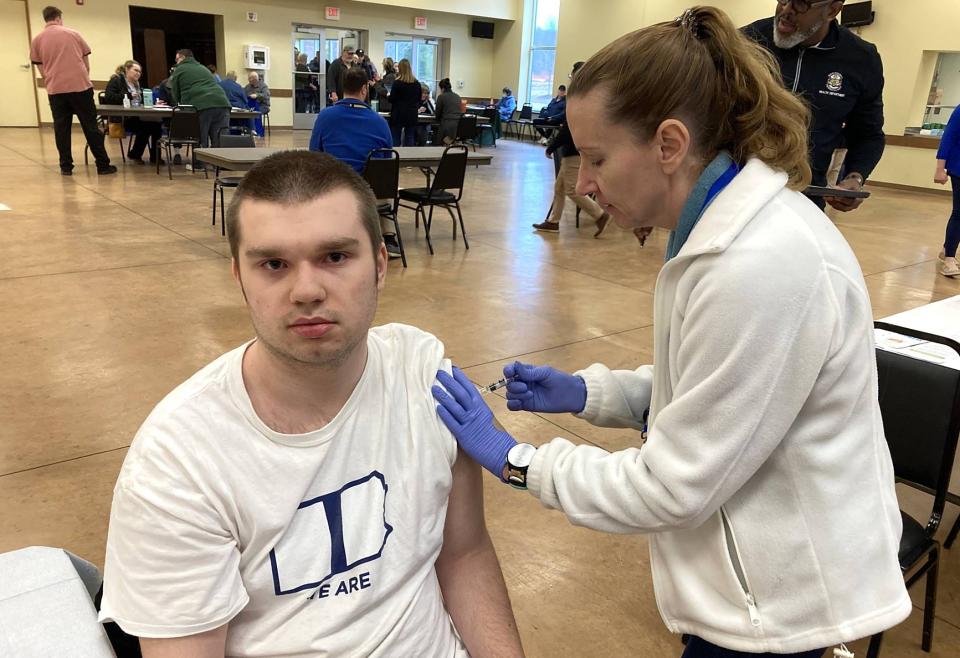Susan Ellsworth, R.N., a nurse with the Erie County Department of Health, gives a dose of hepatitis A vaccine to Joshua Blystone, 19, of Erie, during a hepatitis A vaccine clinic Feb. 27 at the Perry Hi-Way Hose Co. Social Hall, 8281 Oliver Road, Summit Township.