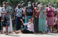 Family members of inmates react outside the prison, following unrest at Mahara Prison, in Colombo