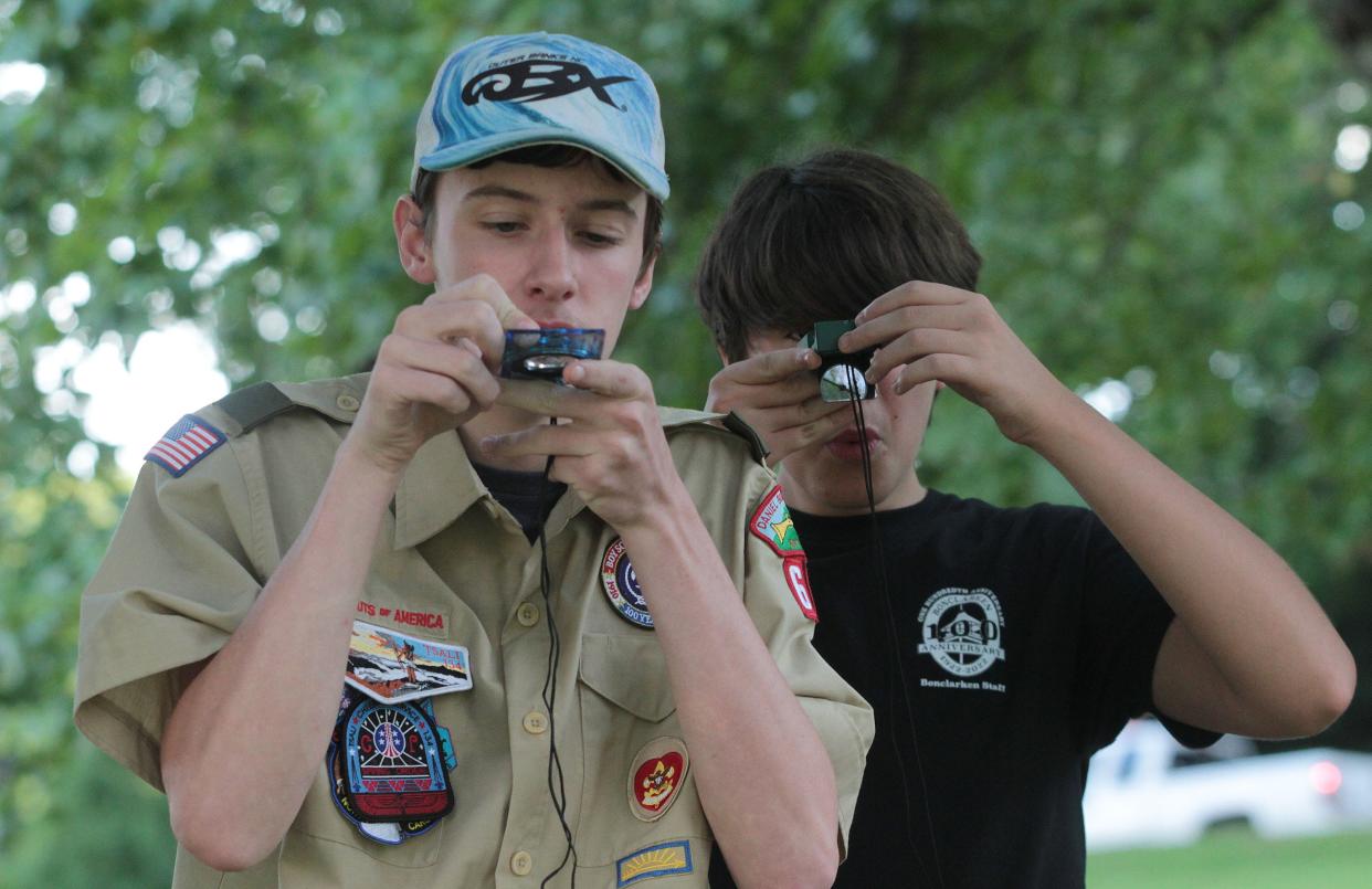 Steven Thompson, left, and Orlando Erkel, both scouts with Hendersonville Boy Scout troop 628 use their compasses to make an orienteering course while working on their orienteering merit badge at Jackson Park on Aug. 25.