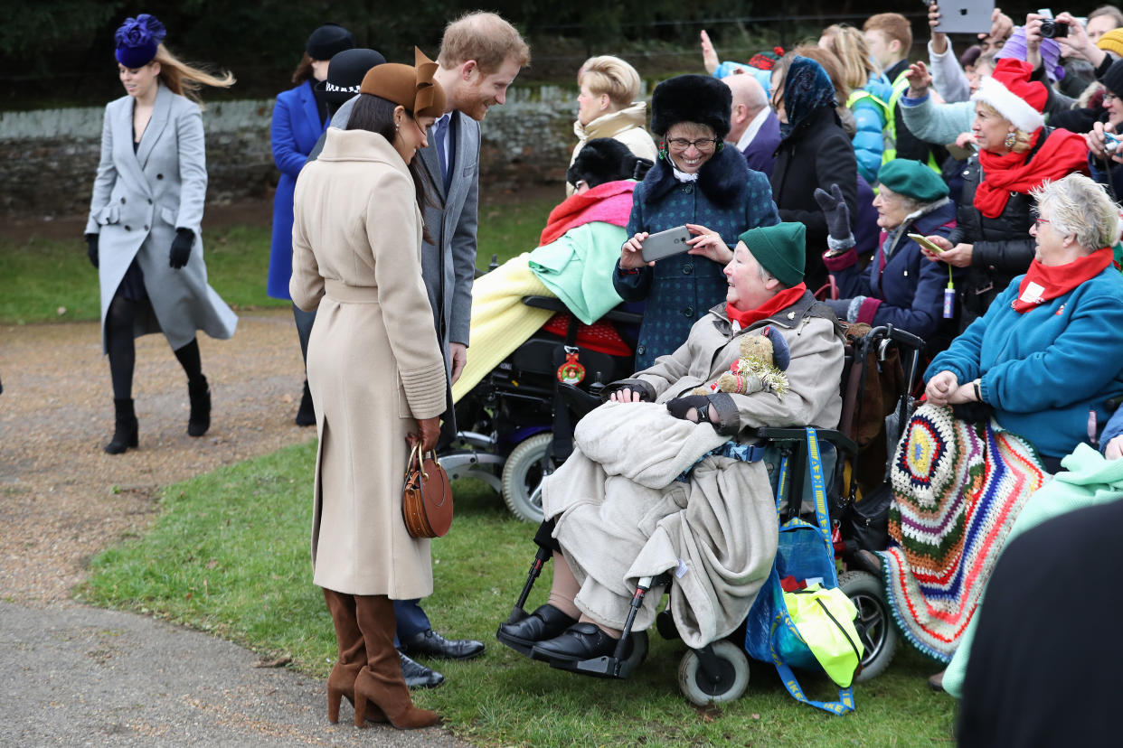 Prince Harry and Meghan Markle greet members of the public. (Photo: Getty)