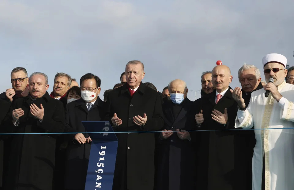 Turkey's President Recep Tayyip Erdogan, center, and South Korean PM Kim Boo-kyum, center left, attend the opening ceremony of the 1915 Canakkale Bridge, in Canakkale, western Turkey, Friday, March 18, 2022. The bridge links the Asian side of Turkey with European side over Dardanelles Strait. (Turkish Presidency via AP)