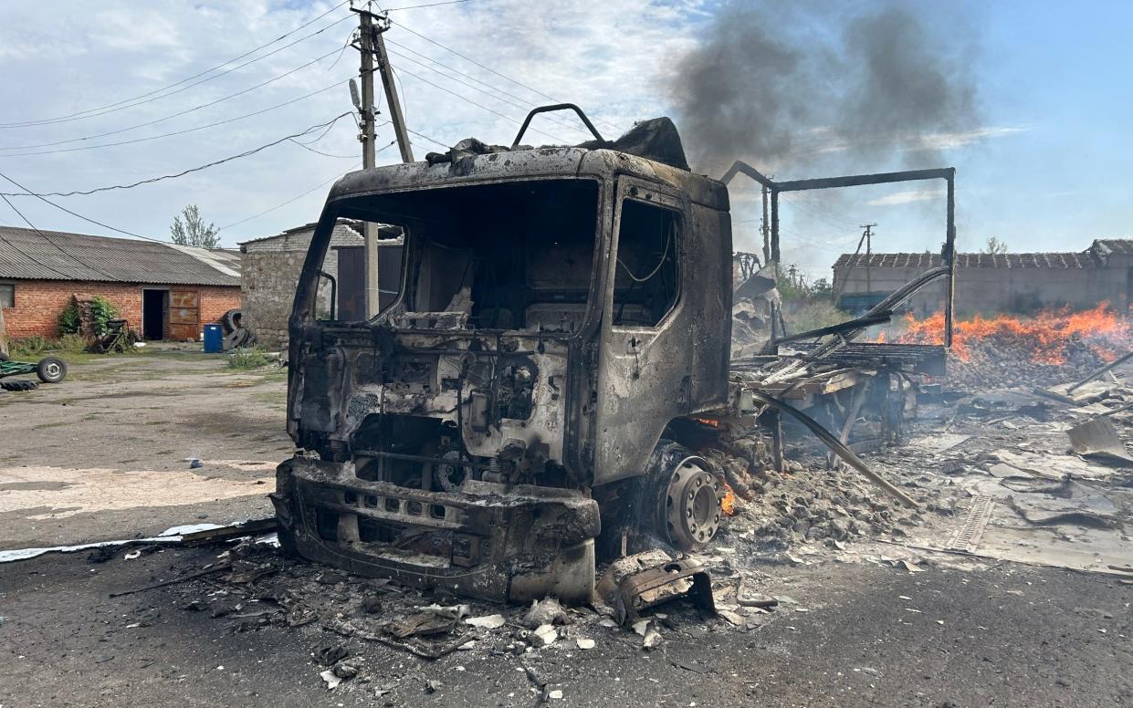 A burnt out Red Cross truck following an alleged Russian military strike