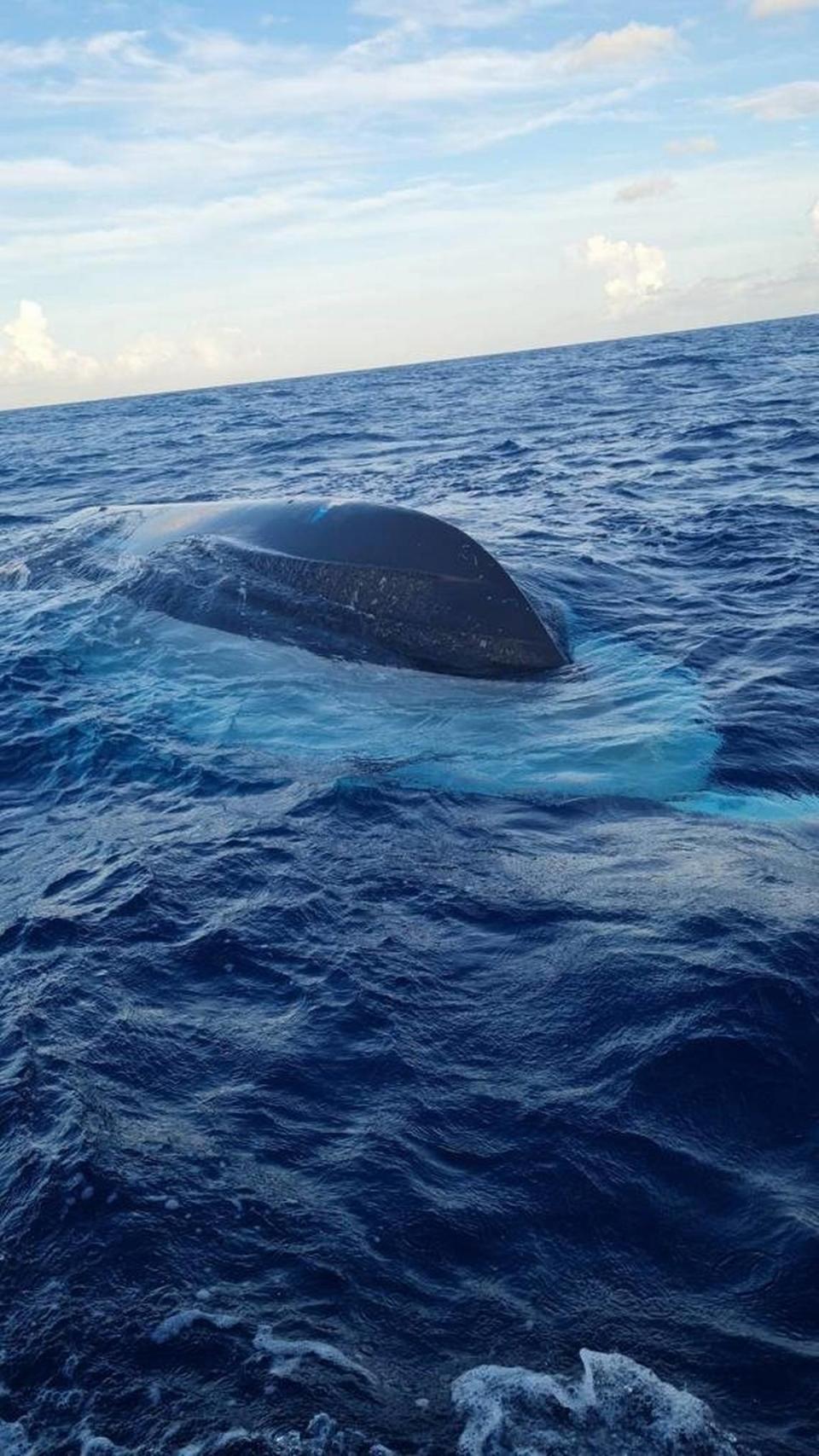 The half-sunk vessel that capsized in Bahamian waters, resulting in the death of at least 17 people suspected to be Haitian migrants on July 24, 2022.