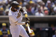 San Diego Padres' Jurickson Profar hits into a force out during the fifth inning of a baseball game against the Milwaukee Brewers, Wednesday, May 25, 2022, in San Diego. Padres' Austin Nola scored from third base on the play. (AP Photo/Gregory Bull)