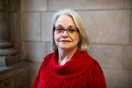 Artist Betsy Ashton poses for a portrait at Riverside Church in New York, U.S., March 10, 2019. Betsy has her "Portraits of Immigrants: Unknown Faces, Untold Stories" on display until April 22, 2019. REUTERS/Demetrius Freeman