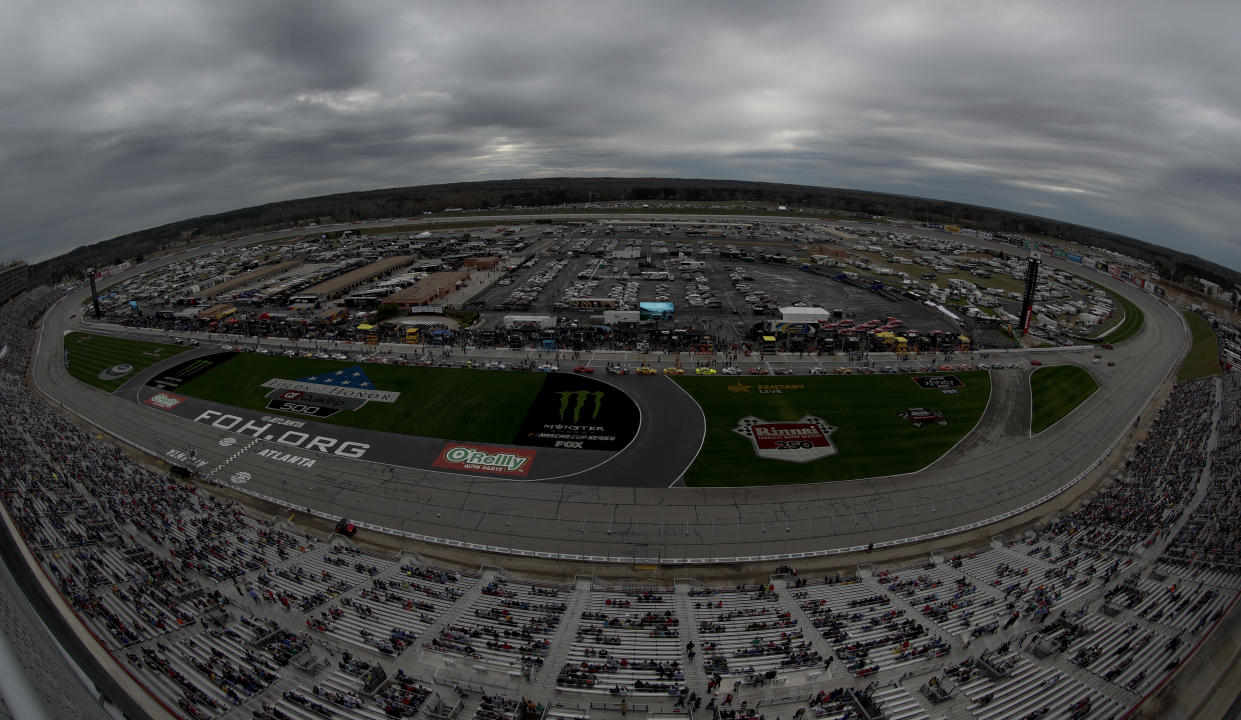 Rain clouds hang over Atlanta Motor Speedway before the start of the NASCAR Cup Series auto race at Atlanta Motor Speedway in Hampton, Ga., on Sunday, Feb. 25, 2018. NASCAR was able to start the race after a rainy morning. (AP Photo/Paul Abell)