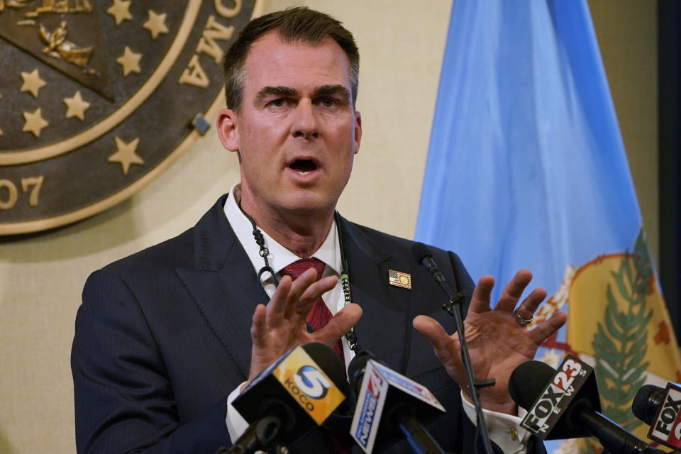 FILE - In this Monday, Nov. 16, 2020, file photo, Oklahoma Gov. Kevin Stitt speaks during a news conference in Oklahoma City. A much-anticipated Medicaid expansion is coming to Oklahoma in 2021 after years of resistance from Republicans in the Legislature and the governor's office. (AP Photo/Sue Ogrocki, File)