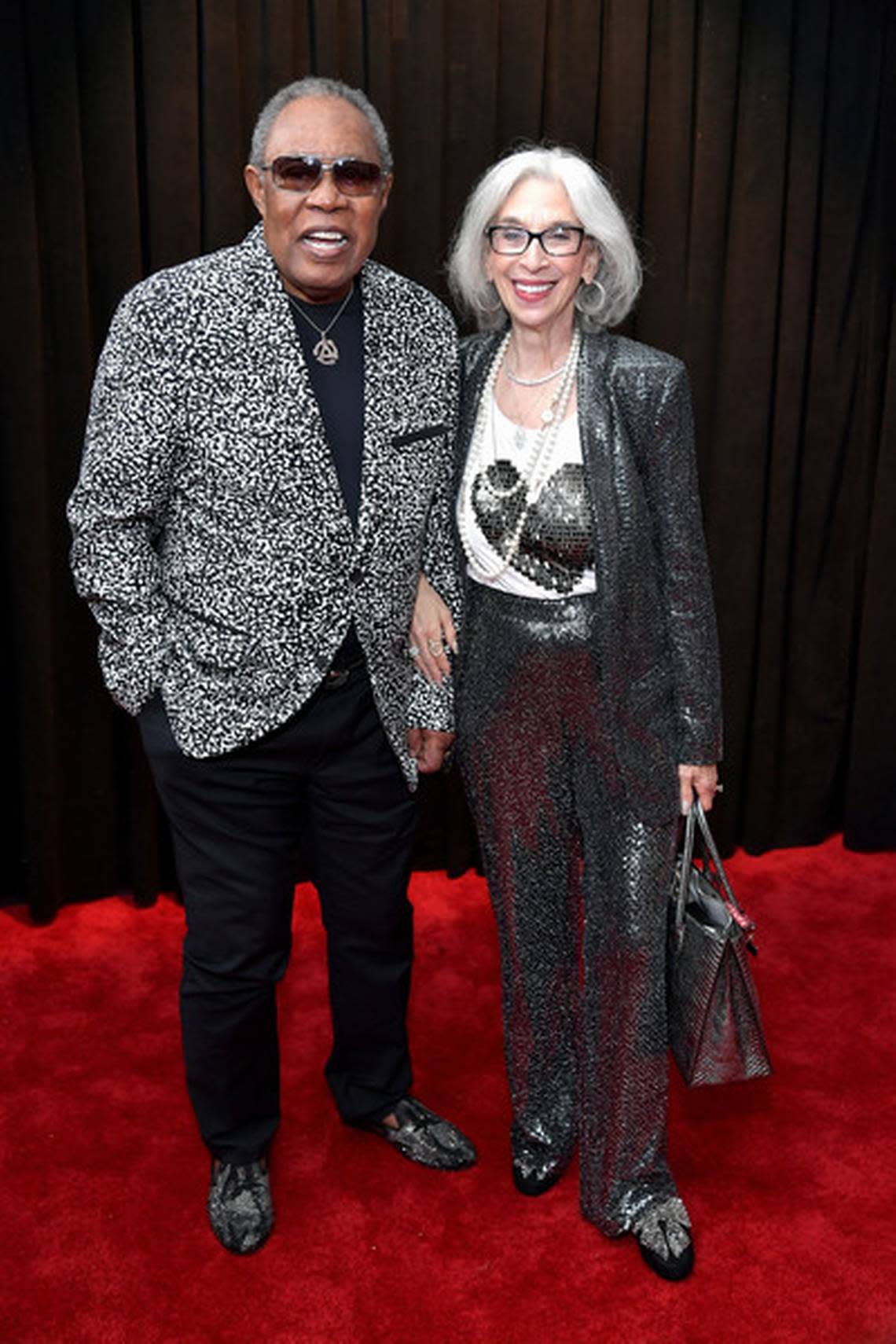 Sam and Joyce Moore on the red carpet at a Miami Heat game in recent years.