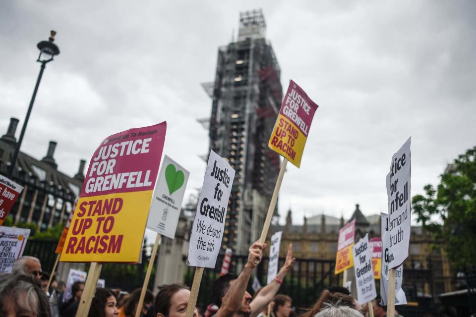 Members of the Justice for Grenfell group march down Whitehall (Getty Images)