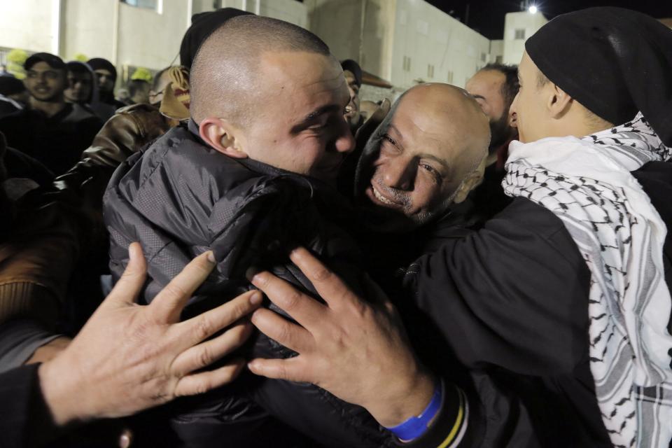 A prisoner released from Israeli prison is welcomed by relatives in the West Bank city of Ramallah