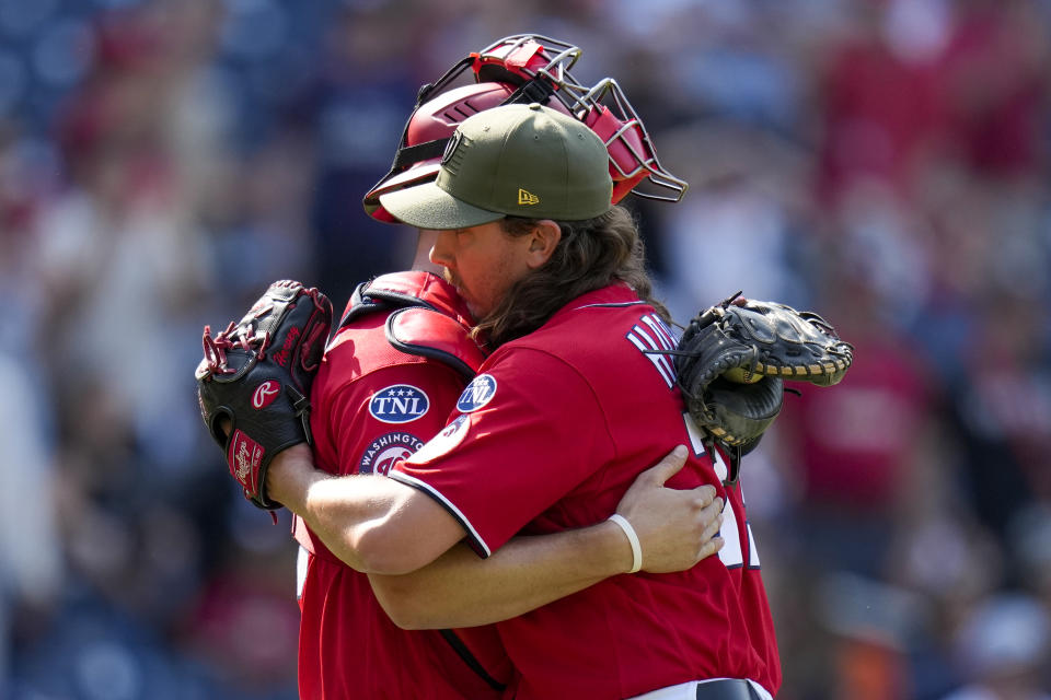 Washington Nationals catcher Riley Adams, left, and relief pitcher Hunter Harvey celebrate after a baseball game against the Detroit Tigers at Nationals Park, Sunday, May 21, 2023, in Washington. The Nationals won 6-4. (AP Photo/Alex Brandon)