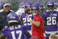 Minnesota Vikings quarterback Kirk Cousins (8) throws during a NFL training camp Friday, July 30, 2021, in Eagan, Minn. (AP Photo/Bruce Kluckhohn)