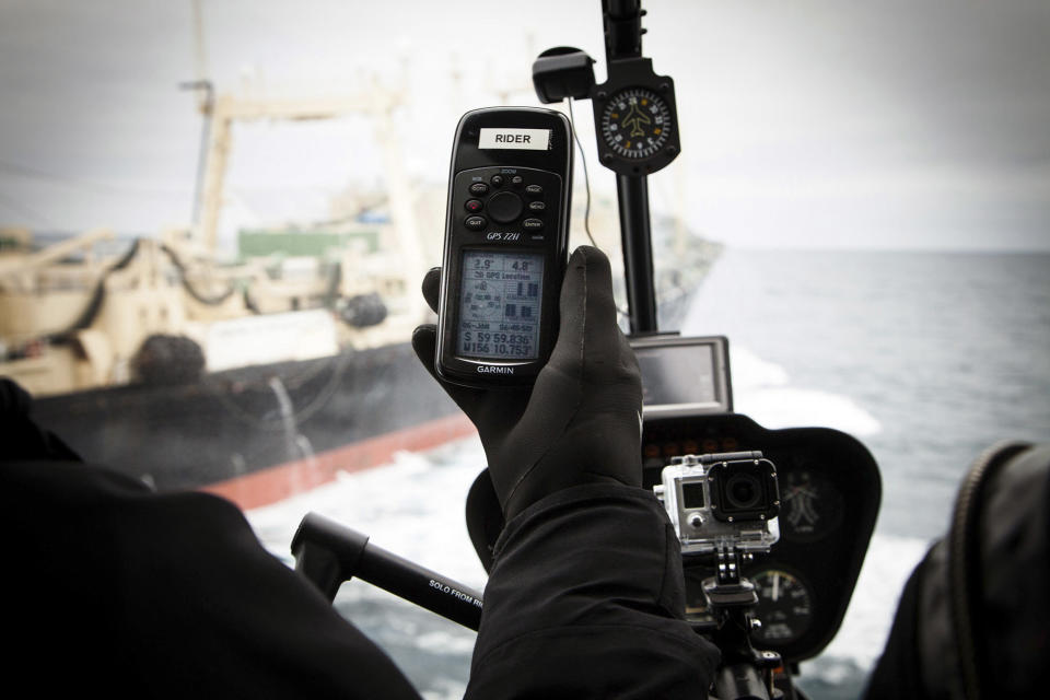 Japanese whaling ship Nisshin Maru is pictured in the background as a GPS unit in a helicopter shows the 60 degree South latitude exclusion zone from an internationally recognised whale sanctuary