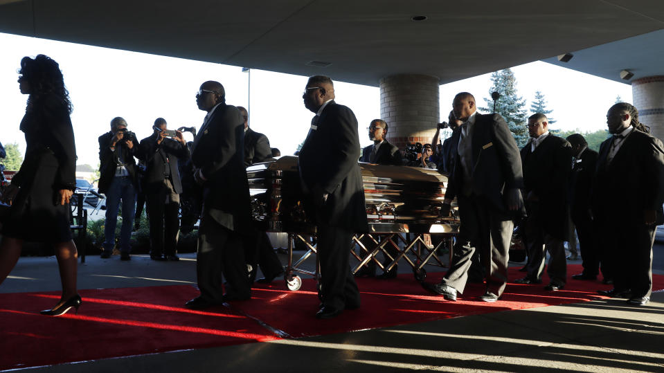 Pallbearers carry the gold casket of legendary singer Aretha Franklin as it arrives at the Greater Grace Temple in Detroit, Friday, Aug. 31, 2018. Franklin died Aug. 16 of pancreatic cancer at the age of 76. (AP Photo/Jeff Roberson)