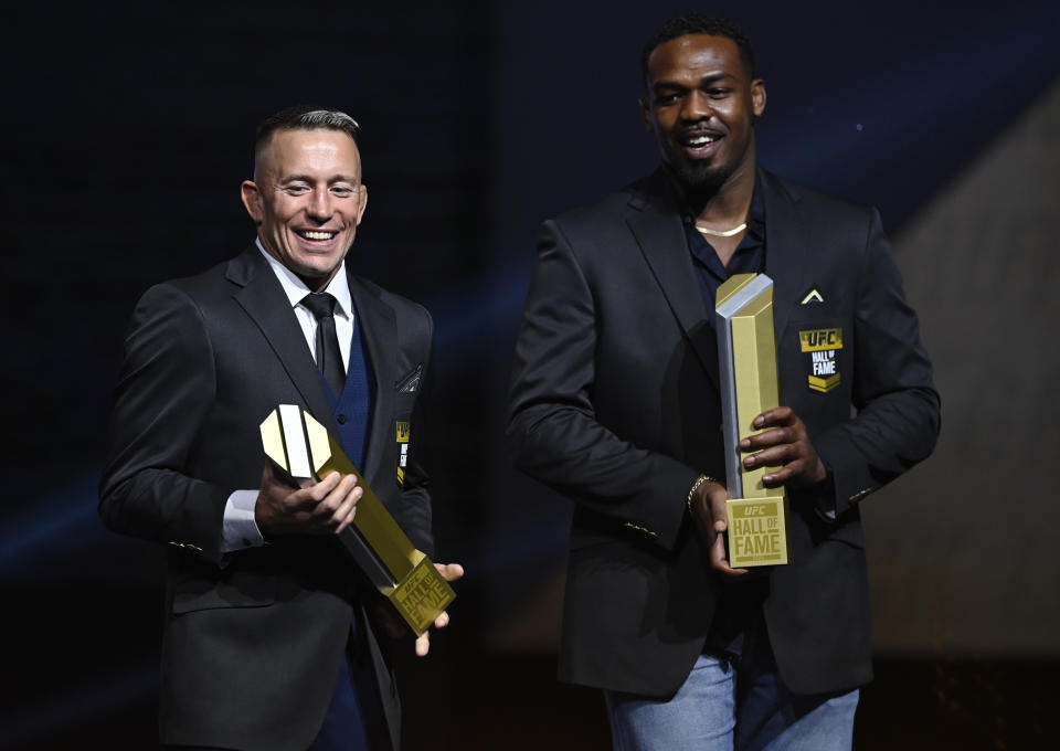 LAS VEGAS, NEVADA - SEPTEMBER 23: Georges St-Pierre and Jon Jones pose for photos during the UFC Hall of Fame Class of 2020 Induction Ceremony at Park Theater at Park MGM on September 23, 2021 in Las Vegas, Nevada. (Photo by Jeff Bottari/Zuffa LLC)