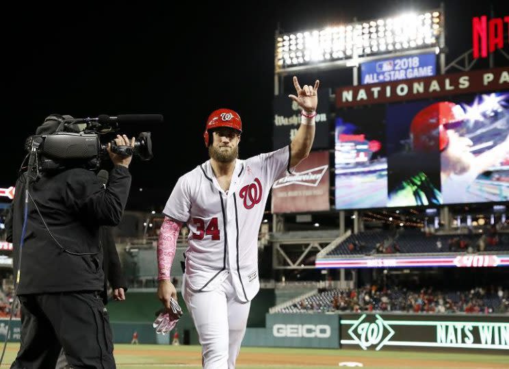 Bryce Harper celebrates his dramatic walk-off home run just hours after signing a record one-year deal with the Nationals. (AP)