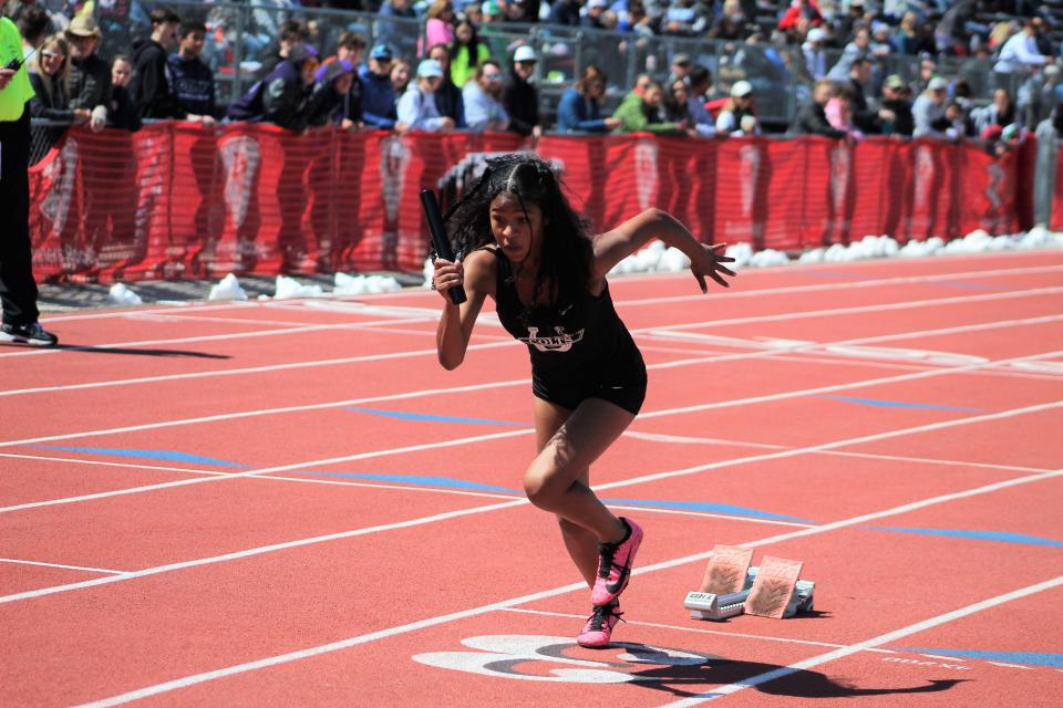 Layla Armijo (Pueblo South) takes off at the start of the 4x100m relay at the 2022 CHSAA state track and field held at Jeffco Stadium on May 21, 2022