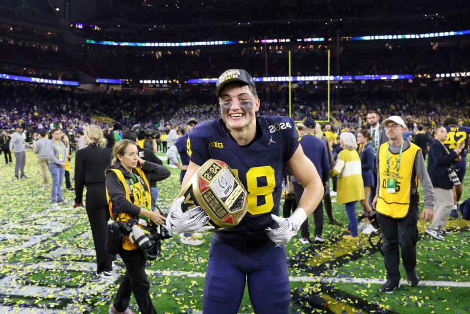 Michigan Wolverines tight end Colston Loveland (18) celebrates after winning 2024 College Football Playoff national championship game against the Washington Huskies at NRG Stadium.