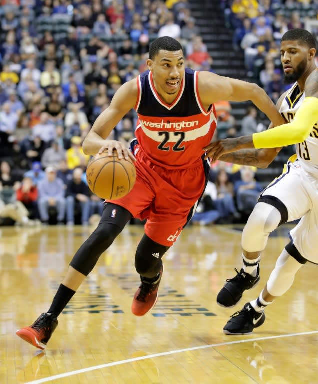 Otto Porter Jr (L) of the Washington Wizards, seen in action during their game against the Indiana Pacers, at Bankers Life Fieldhouse in Indianapolis, Indiana, on February 16, 2017