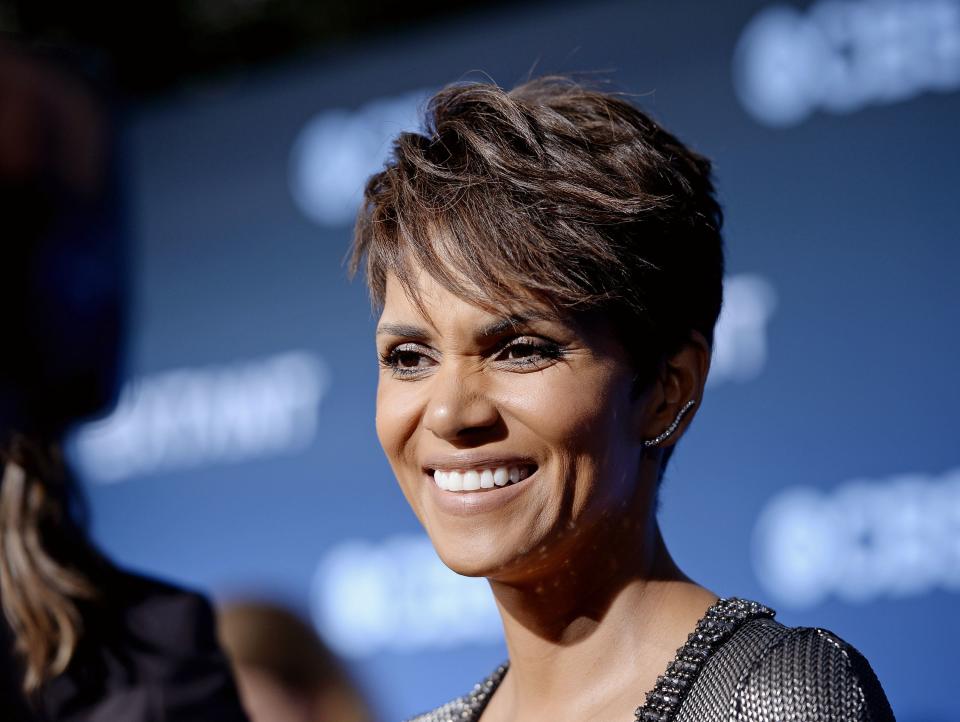 Cast member Halle Berry smiles during interview at premiere of TV series "Extant" in Los Angeles