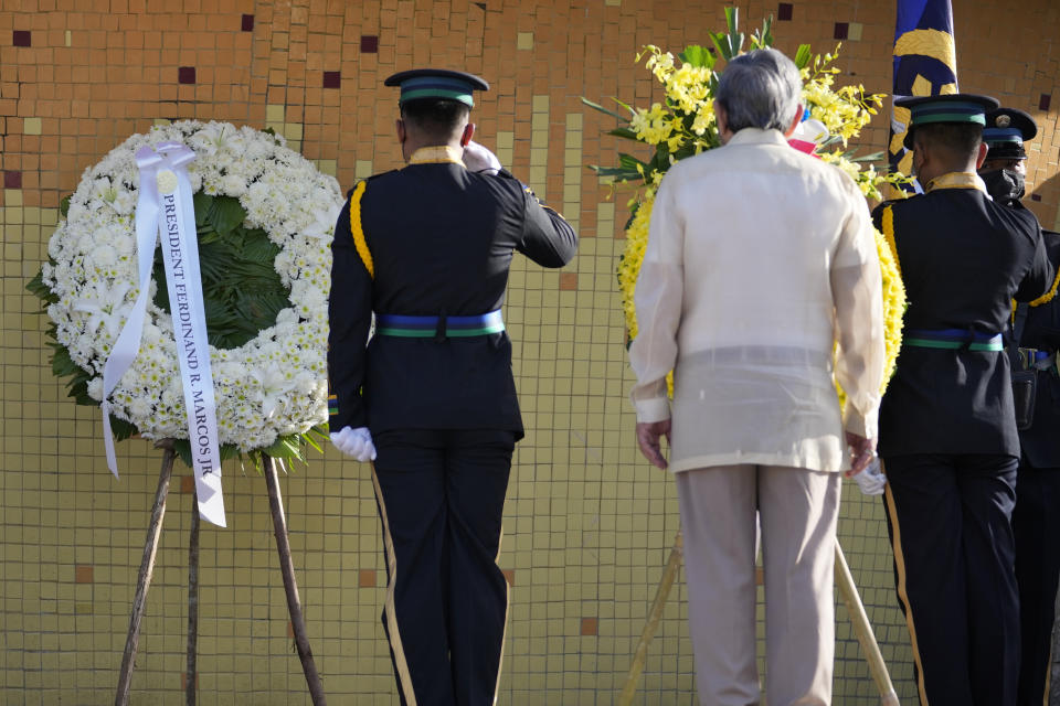 A wreath with the name of Philippine President Ferdinand Marcos Jr. is seen during ceremonies marking the 37th anniversary of the near-bloodless coup popularly known as "People Power" revolution that ousted his father, the late Philippine dictator Ferdinand Marcos, from 20-year-rule at the People's Power Monument in Quezon city, Philippines on Saturday Feb. 25, 2023. It is the first year marking the event under the rule of Marcos Jr. (AP Photo/Aaron Favila)