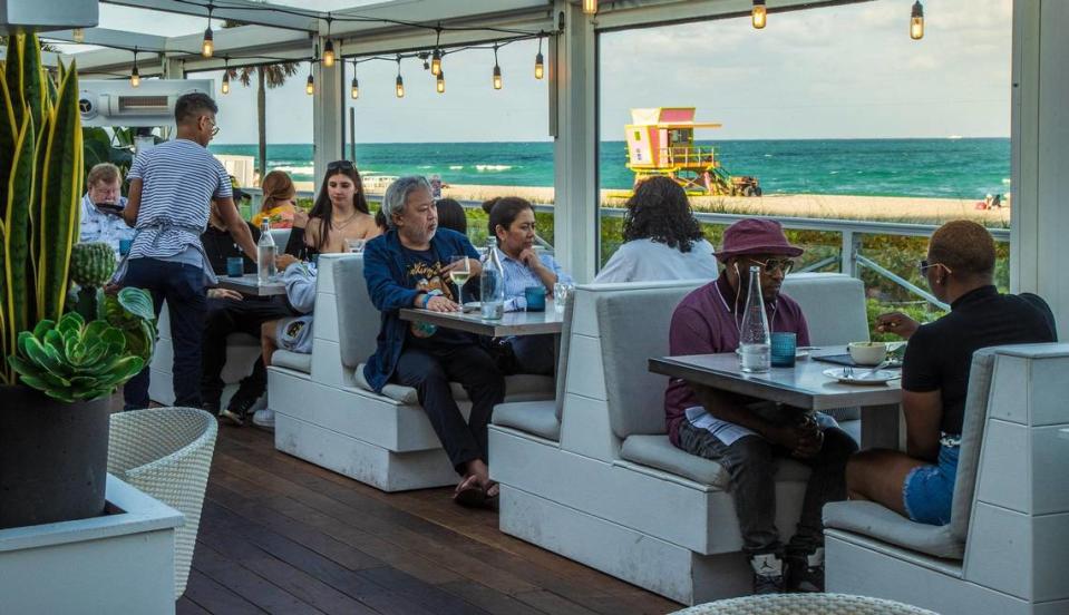 Guests dine in the outdoors dining room at Ocean Social by Tristen Epps on Miami Beach. Pedro Portal