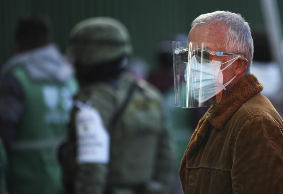 A man over age 60 waits to get the AstraZeneca vaccine against COVID-19 as Mexico begins to vaccinate its elderly population against the new coronavirus in the Magdalena Contreras area of Mexico City, Monday, Feb. 15, 2021. (AP Photo/Marco Ugarte)