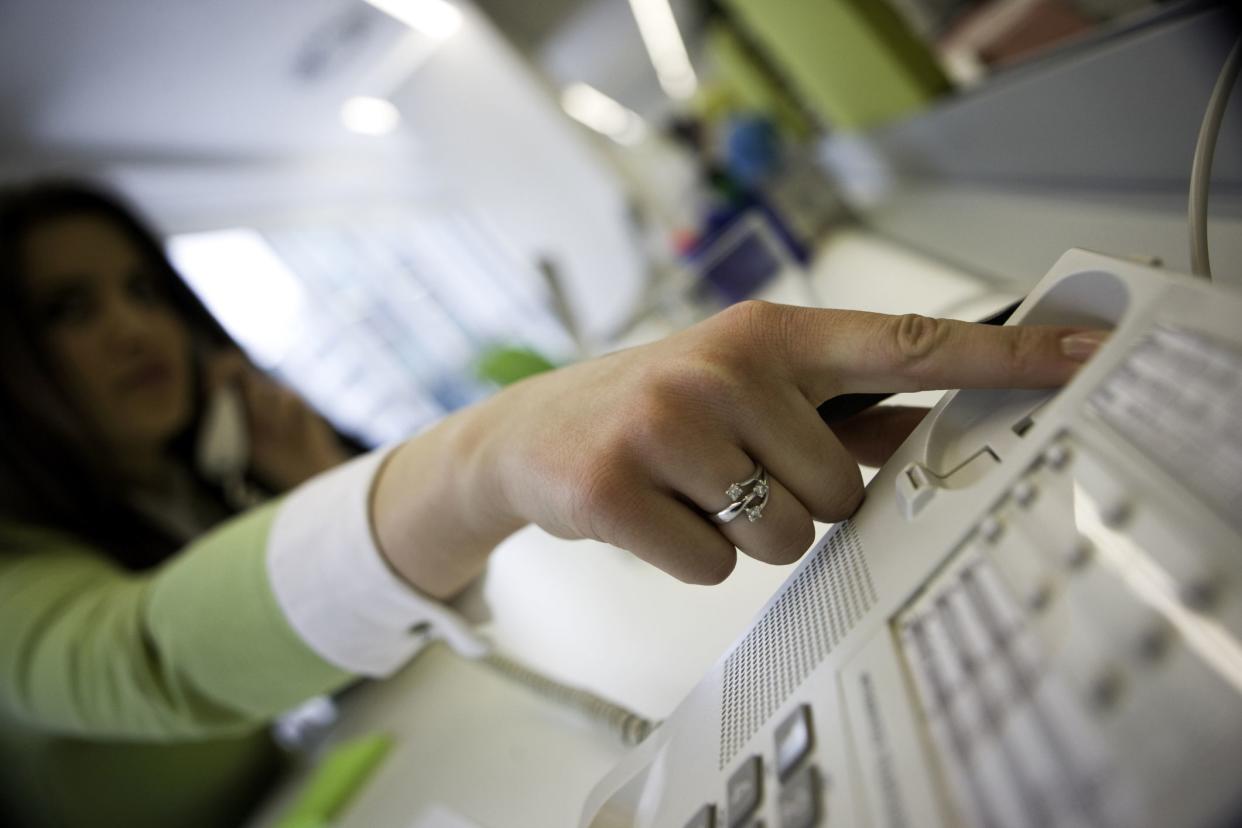 woman pressing button to hang up call