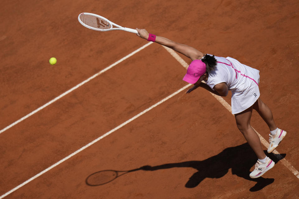 Poland's Iga Swiatek serves the ball to Germany's Angelique Kerber at the Italian Open tennis tournament in Rome, Monday, May 13, 2024. (AP Photo/Alessandra Tarantino)