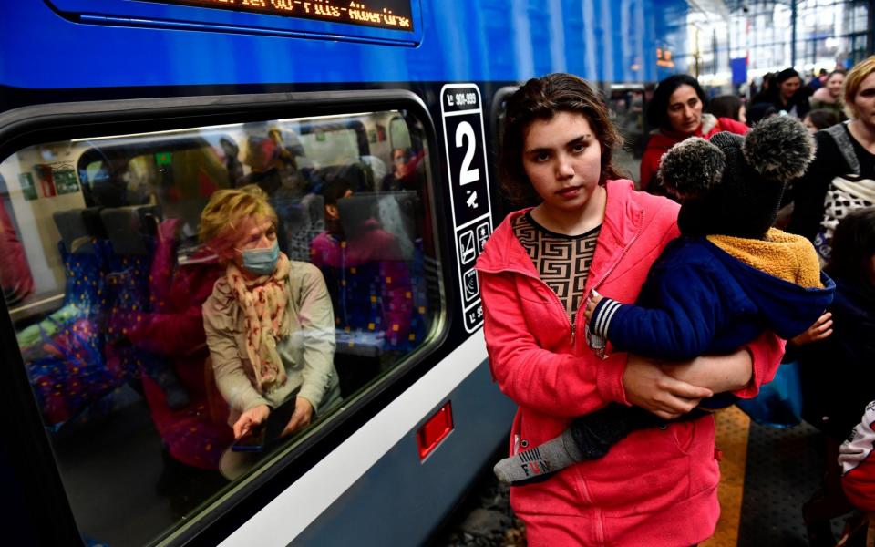 Refugees who have fled from Ukraine arriving at Nyugati station in Budapest, Hungary - Marton Monus/Reuters