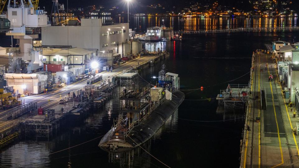 The stricken fast-attack submarine Connecticut returns to the dry dock on July 12 following Puget Sound Naval Shipyard, Washington, upgrades that officials say will allow the facility to better withstand a catastrophic earthquake. (Navy)