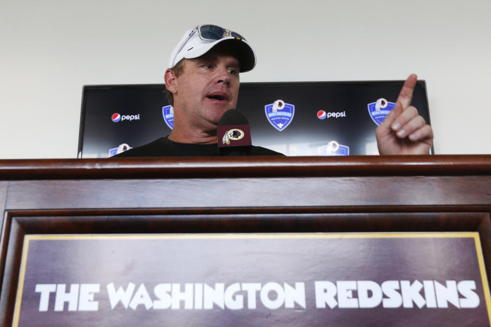 Washington Redskins head football coach, Jay Gruden, gestures during a news conference at the Redskins NFL training camp in Charlottesville, Va., Wednesday, July 24, 2019. (AP Photo/Steve Helber)