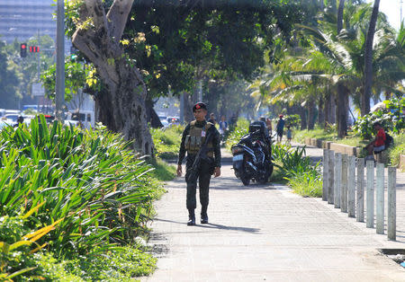 A member of the Philippine National Police (PNP) Special Action Force patrol after an Improvised Explosive Device (IED) was found near the U.S Embassy in metro Manila, Philippines November 28, 2016. REUTERS/Romeo Ranoco