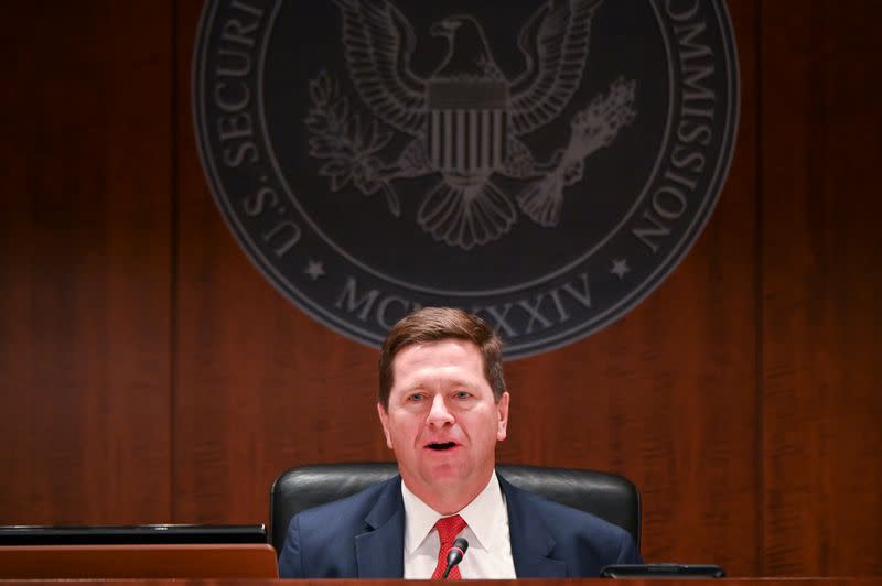 FILE PHOTO: Chairman Clayton participates in a U.S Securities and Exchange Commission open meeting to propose changing its definition of an "accredited investor" in Washington