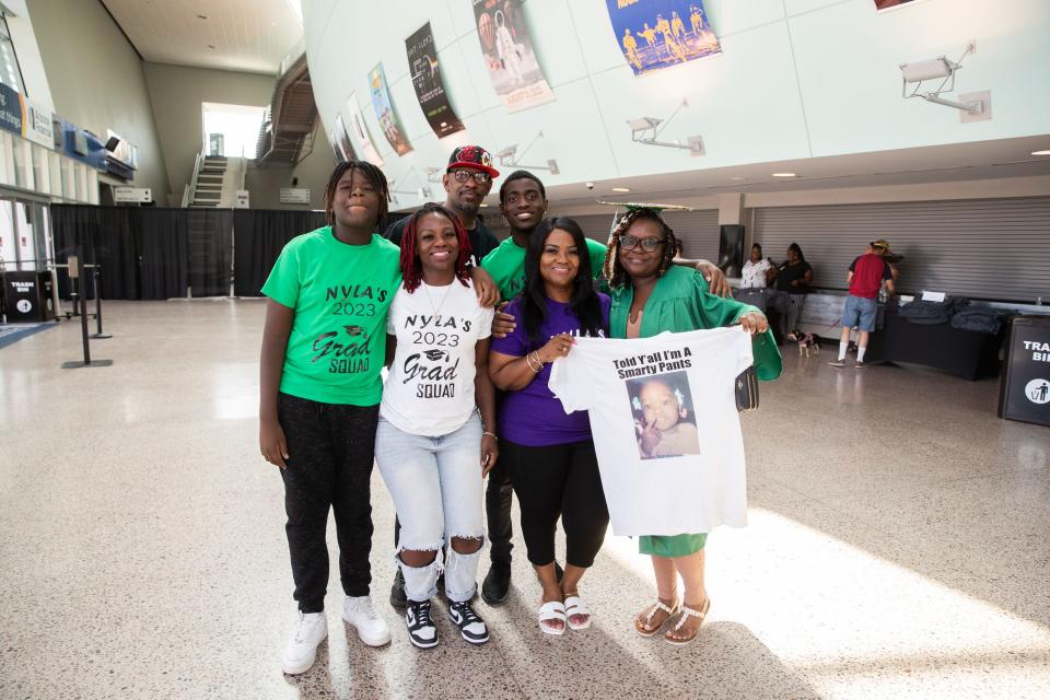 The Porter family poses for a photo during an in-person graduation ceremony for the Primavera Online School at the Arizona Financial Theatre in Phoenix on July 6, 2023.