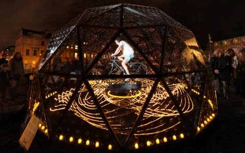 Bruce Munro demonstrates his 'Star-Turn' installation in front of the Holburne Museum in Bath - Credit: Matt Cardy/Getty