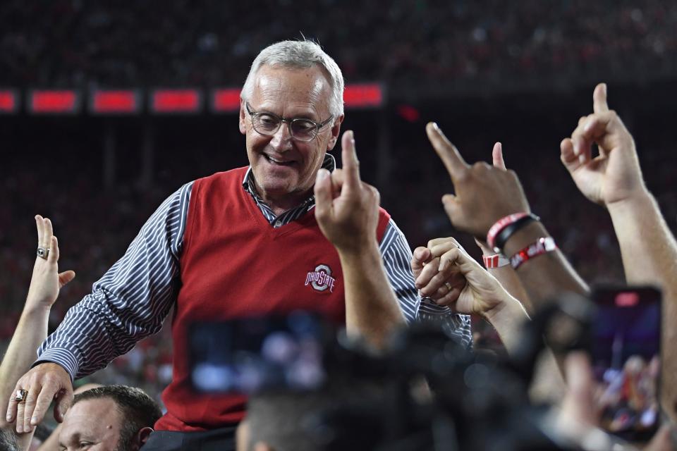 Former Ohio State coach Jim Tressel is carried on the shoulders of his 2002 national championship team during the second quarter of the Buckeyes' home game against Notre Dame, Saturday, Sept. 3, 2022, in Columbus.