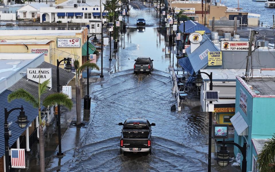 Flood waters inundate the main street in Tarpon Springs, Florida