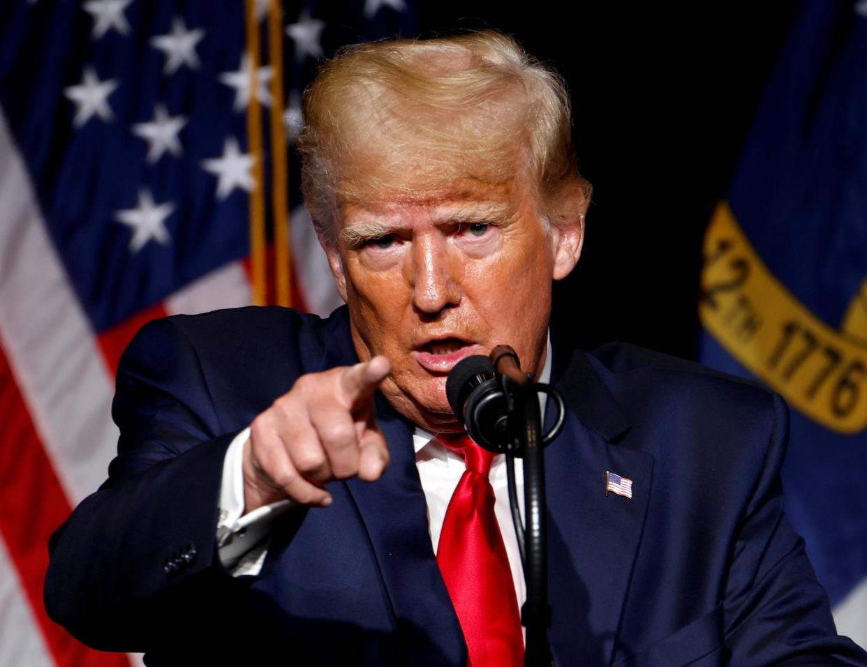 File image: Former US President Donald Trump points at the media while speaking at the North Carolina GOP convention dinner in Greenville, North Carolina, US, on 5 June, 2021 (REUTERS)