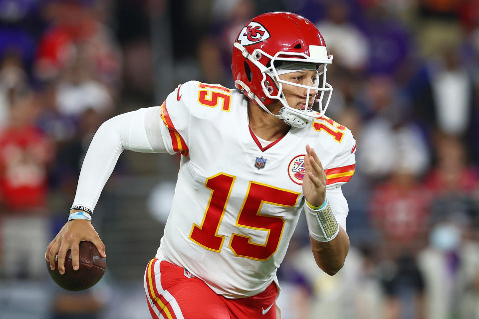 BALTIMORE, MARYLAND - SEPTEMBER 19: Patrick Mahomes #15 of the Kansas City Chiefs scrambles with the ball against the Baltimore Ravens during the second quarter at M&T Bank Stadium on September 19, 2021 in Baltimore, Maryland. (Photo by Todd Olszewski/Getty Images)