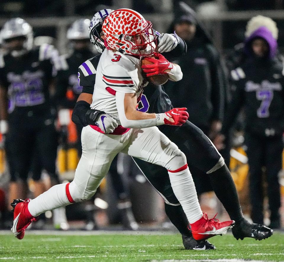 Center Grove Trojans Noah Coy (3) rushes up the field Friday, Nov. 17, 2023, during the IHSAA semi state championship game at Ben Davis High School in Indianapolis. The Ben Davis Giants defeated the Center Grove Trojans in overtime, 37-34.