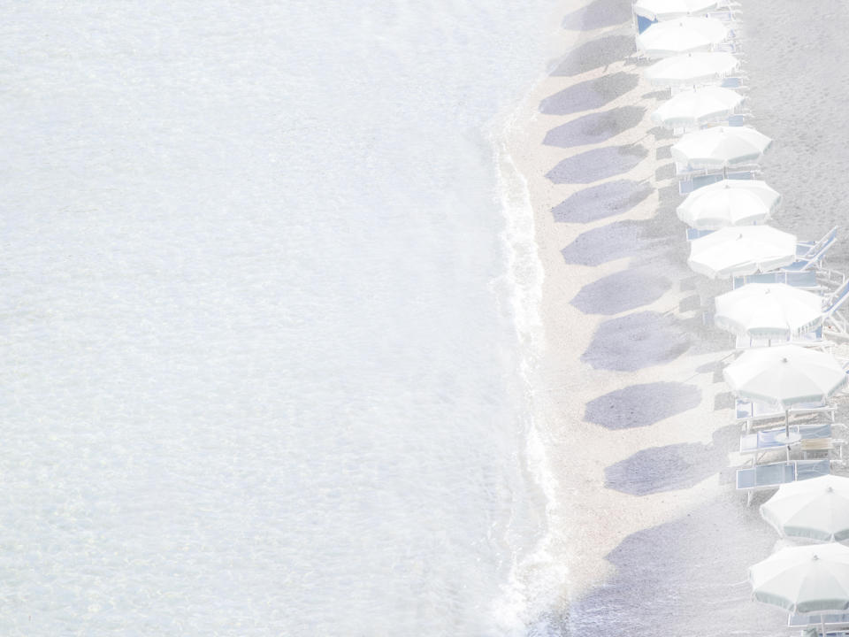 This undated photo shows one of San Francisco-based photographer Caroline Pacula's prints. Pacula's serene, relaxing images of sunny beachside activities, available in print form at Serena & Lily, may help cure the quarantine-induced wanderlust. (Caroline Pacula/Serena & Lily via AP)