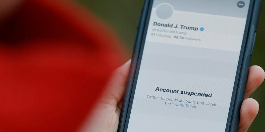 The suspended Twitter account of U.S. President Donald Trump appears on an iPhone screen