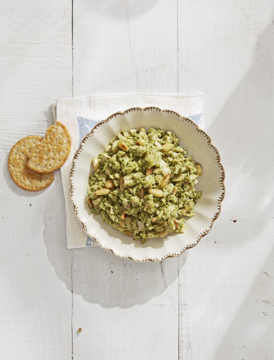 <p>Your guests will love this delicious pesto chicken salad, packed with crunchy toasted pine nuts and perfect on a cracker or in a sandwich.</p><p><strong><a href="https://www.countryliving.com/food-drinks/a30614091/pesto-chicken-salad-recipe/" rel="nofollow noopener" target="_blank" data-ylk="slk:Get the recipe for Pesto Chicken Salad;elm:context_link;itc:0;sec:content-canvas" class="link ">Get the recipe for Pesto Chicken Salad</a>.</strong></p>