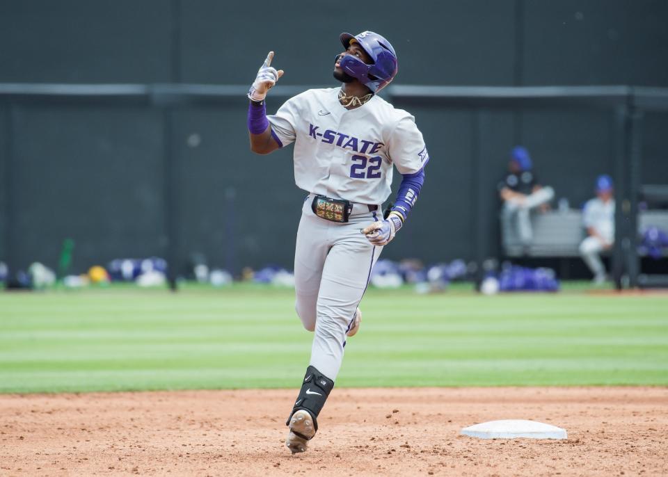 Kansas State Wildcats infielder Kaelen Culpepper (22) points up after hitting a home run during the game against the Oklahoma State Cowboys at O'Brate Stadium.