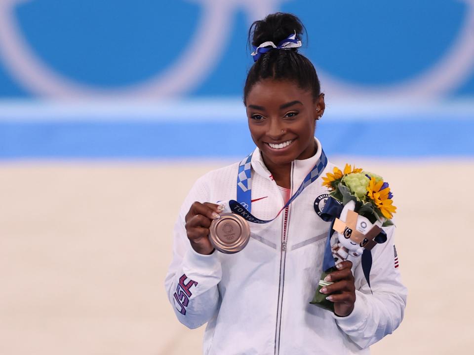 Simone Biles of Team United States poses with the bronze medal (Getty)