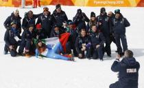 Alpine Skiing - Pyeongchang 2018 Winter Olympics - Women's Downhill - Jeongseon Alpine Centre - Pyeongchang, South Korea - February 21, 2018 - Gold medallist Sofia Goggia of Italy poses for photos with her team members. REUTERS/Leonhard Foeger