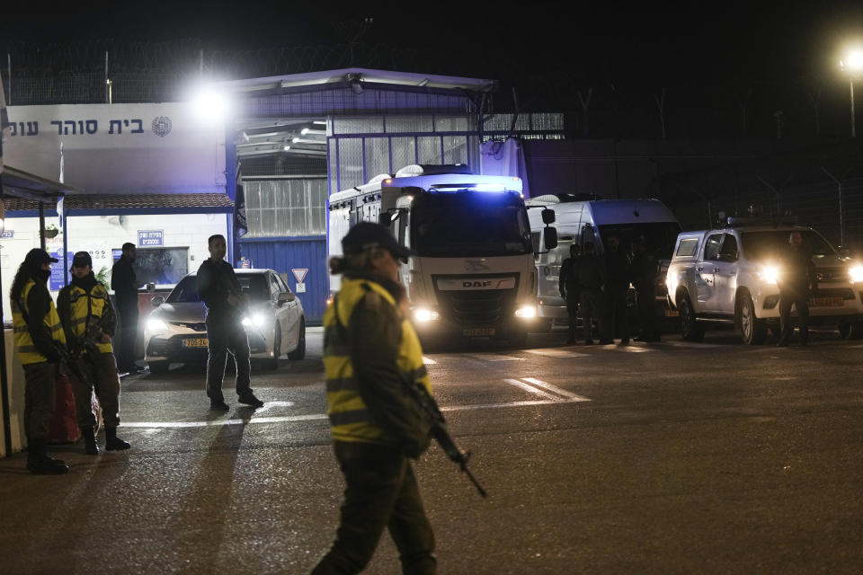 An Israeli prison transport vehicle carries Palestinian prisoners released by the Israeli authorities from Ofer military prison near Jerusalem on Friday, Nov. 24, 2023. The release came on the first day of a four-day cease-fire deal between Israel and Hamas during which the Gaza militants have pledged to release 50 hostages in exchange for 150 Palestinians imprisoned by Israel. (AP Photo/Mahmoud Illean)