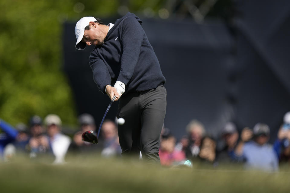 Rory McIlroy, of Northern Ireland, hits his tee shot on the 12th hole during the first round of the PGA Championship golf tournament at Oak Hill Country Club on Thursday, May 18, 2023, in Pittsford, N.Y. (AP Photo/Eric Gay)