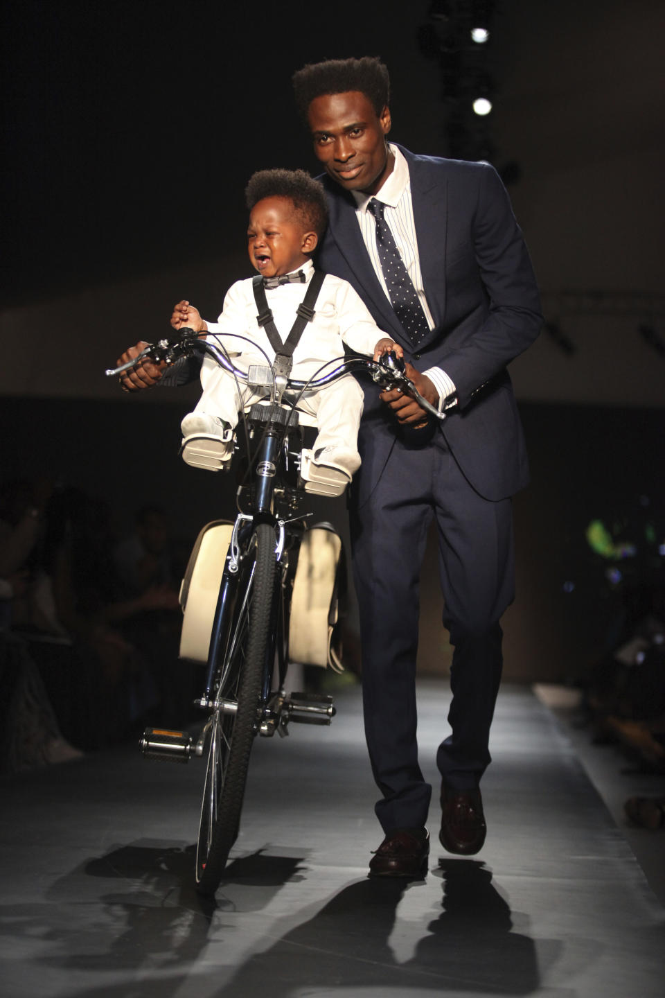 A model displays an outfit by designer Okunoren Twins of Nigeria at the ARISE Fashion Week event in Lagos, Nigeria on Sunday, March 11, 2012. (AP Photos/Sunday Alamba)